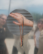 Whorl pendant & suede + silk whipstitch cord