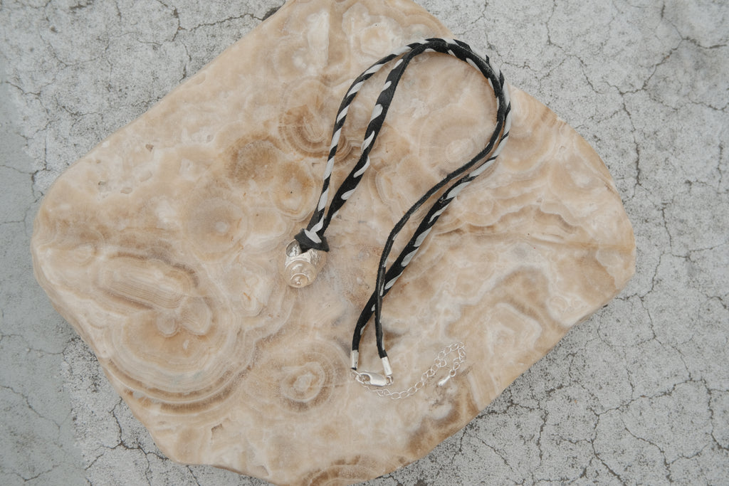 Whorl pendant & suede + silk whipstitch cord