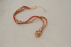 Whorl pendant & suede + silk whipstitch cord